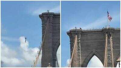 44-year-old man climbs Brooklyn Bridge, strips naked, plants flags and jumps into East River; survives, identified and charged by NYPD