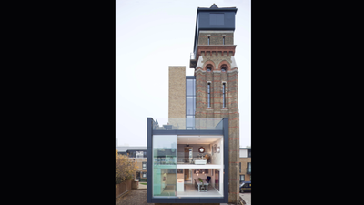 A British couple bought a derelict 85-foot, seven-storey Victorian water tower at auction; after years of painstaking work, the former asylum water supply became their family home
