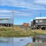 A remote Alaska village is slowly sinking as the frozen ground beneath it thaws, releasing ancient carbon locked away for thousands of years
