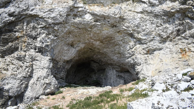 Archaeologists found a young woman, believed to be 14 to 19, buried with a 32-to 34-week fetus in a Swedish cave; the remains may be up to 9,500 years old