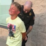 Colorado mom gets her son ‘arrested’ by police after he refuses to take a first-day-of-school photo, with officer handcuffing him in hilarious prank