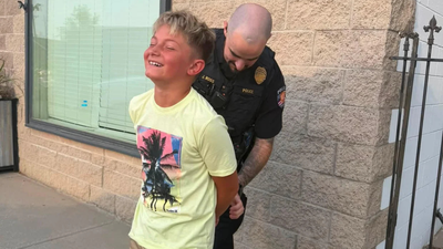 Colorado mom gets her son ‘arrested’ by police after he refuses to take a first-day-of-school photo, with officer handcuffing him in hilarious prank