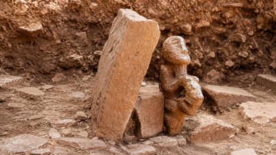 a unique 11,000-year-old statue of a human sitting on a leopard was unearthed at karahantepe | World News
