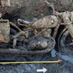 Budapest’s low Danube exposed two German soldiers and a DKW military motorcycle; mud mixed with gas oil preserved identity discs after around 80 years