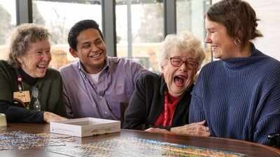 In 2022, a Wisconsin retirement community began housing college students; they now pay about 0 monthly and volunteer eight hours each week with older residents