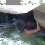 California woman was swept down the Kern River and found clinging beneath a rock; rescuers pulled her from the rapids