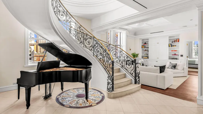 A gold-domed New York City penthouse first listed for $25 million has sold for $9 million after 530 days on the market, with owner Greg Carr directing the sale proceeds to his conservation project
