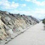 New Jersey built a massive seawall to protect a highway and beach houses from erosion; USGS says the wall concentrated wave energy until the beach it was meant to defend disappeared completely