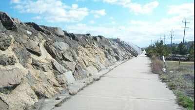 New Jersey built a massive seawall to protect a highway and beach houses from erosion; USGS says the wall concentrated wave energy until the beach it was meant to defend disappeared completely