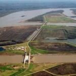The US built nearly 2,000 km of Mississippi River levees to control floods; the barriers cut sediment off from Louisiana wetlands, helping erase about 4,900 sq km of coastal land