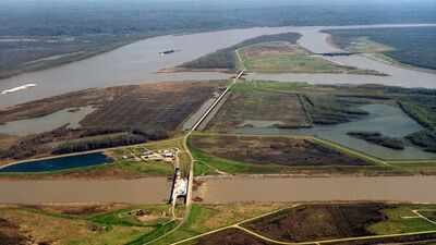 The US built nearly 2,000 km of Mississippi River levees to control floods; the barriers cut sediment off from Louisiana wetlands, helping erase about 4,900 sq km of coastal land