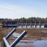 In 2020, a Michigan dam failure drained Sanford Lake; six years later, the water returned and a beach festival launched in 2005 came back to its original shoreline