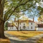 A 1762 Virginia house stood in Sussex County for 184 years, then was dismantled piece by piece in 1946 and rebuilt on land once part of George Washington’s Mount Vernon estate; listing now contingent at .799 million