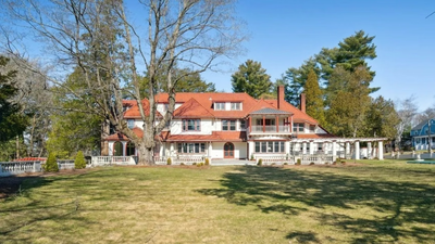 A 1914 Massachusetts mansion built after a high-society scandal is listed for .5 million; the 10,269-square-foot estate has 12 bedrooms, Italian gardens and a 39-foot ballroom