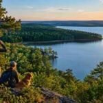 A North Carolina land trust has saved the first 200 acres around Tuckertown Reservoir after 1,400 donors joined the campaign; another 3,800 privately owned acres remain at risk of sale and development
