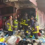 A San Francisco bystander heard screams from a garbage truck after its load had been compacted; 25 firefighters spent more than 2 hours digging a trapped man out alive