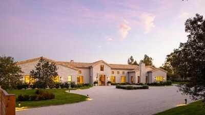A California woman built a 10,363-sq-ft French-style mansion with centuries-old materials sourced from around the world; no one has lived in it, and it is now asking M