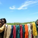 A Chinese village collected plastic from its mangroves and turned the waste into silk-like scarves for volunteers, linking cleanup with recycling | World News