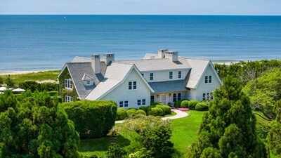 Once part of the historic Wiborg Estate, Lee Radziwill’s East Hampton home sold for $16.2M in 2001; rebuilt after a 2013 fire, ‘Dune Cottage’ was listed for $120M before selling for $72M