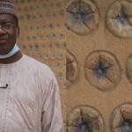 A Nigerian engineer built his first model house with 14,800 sand-filled plastic bottles; the experiment later grew into 15 houses, including a five-bedroom duplex