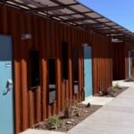 Phoenix turned shipping containers into 40 private transitional homes for homeless seniors; each 160-sq-ft unit has a bathroom, and 56 permanent apartments are planned next