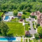 Once priced at .5 million, a 151-acre New York estate is now going to auction; its 14,000-sq-ft mansion could sell for as little as  million