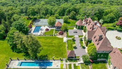 Once priced at $29.5 million, a 151-acre New York estate is now going to auction; its 14,000-sq-ft mansion could sell for as little as $5 million