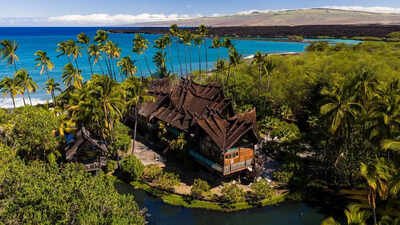 In 1994, 280 craftsmen built a Balinese estate from Indonesian ironwood and teak; dismantled and shipped to Hawaii, it was rebuilt with more than 1 million shingles and is now asking .5 million