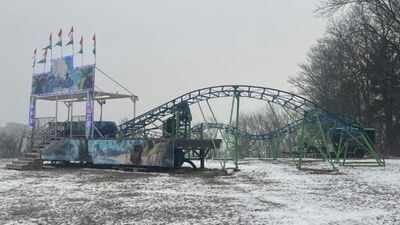 A Pennsylvania grandfather built a backyard amusement park with a 105-foot waterslide, go-kart track and vintage carousel; his $24,700 roller coaster then triggered a zoning fight