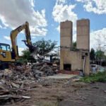 Cheyenne’s Twin Chimneys motor court stood for almost 90 years; this week its landmark chimneys fell in about 30 seconds to make way for a drive-thru coffee shop
