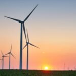 An Iowa farmer gave about 2 acres to two wind turbines and related infrastructure; by 2021, the ,000 annual lease was what he called the most profitable part of his corn-and-soybean farm