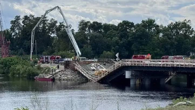 Maine was replacing an aging river bridge when part of the new structure collapsed during a concrete pour and injured workers; two months later, crews are dismantling the damaged spans before construction resumes