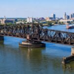 Toledo’s 1897 railroad swing bridge was bought for  in 2004; a new  million overhaul will replace nine fixed spans and reinforce the movable section to carry heavier 286,000-pound railcars