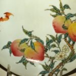Between 1723 and 1735, Qing artisans made a porcelain bowl painted with bats and peaches; after passing through a Paris dealer and spending 87 years at a Chicago museum, it sold for .048 million in New York