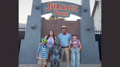 A California family spent about $4,000 and more than 200 hours turning its front yard into Jurassic Park, building 13-foot gates and a dinosaur escape show that visitors can watch for free