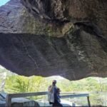 An 80-ton boulder that had hung above visitors at New Hampshire’s Polar Caves since the park opened in 1922 collapsed on the final day of the 2026 season, smashing a walkway but injuring no one