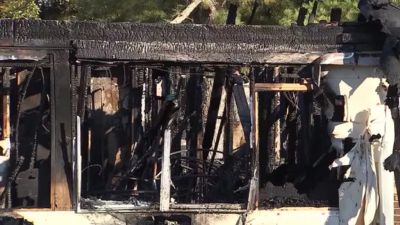 A driver headed home to Alabama took a wrong turn in Georgia and spotted a house on fire, then rushed inside to wake a sleeping family of 14; the couple say they have fostered more than 500 children over 15 years