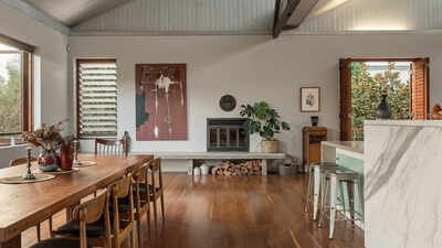 ​An old Brisbane hospital outbuilding was transformed into a five-bedroom home, with its industrial sawtooth roof and exposed brick left intact; the unique home on a 1,008 sq m plot sells for A$4.45 million