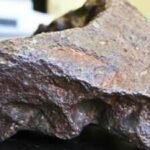 A 10.22-kg rock used as a Michigan barn doorstop for decades was identified as a new iron meteorite |