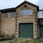 A couple bought a derelict Land Rover dealership for £330,000 and turned it into a five-bedroom home; the forecourt can fit around 50 cars | World News