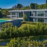 A developer bought a 0.59-acre Bel Air lot for .25 million in 2017 and spent nine years building a 10,950 sq ft brutalist mansion from 4,500 tons of reinforced concrete; it is now listed for .5 million