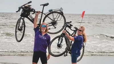 A Utah couple began cycling across America on their 40th wedding anniversary; 87 days and 3,634 miles later, they reached the Atlantic coast and raised about ,000 for two community charities