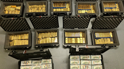 Federal executive with top-secret clearance created a fake classified program and diverted $145 million into luxury property and gold; after FBI found 298 gold bars, he pleaded guilty to a $193.6 million fraud