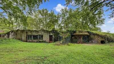 In 1977, an Illinois man built an underground house with rocks he collected on trips to Colorado to fight rising energy costs; nearly 50 years later, the 2,300-sq-ft ‘caveman’ home is listed for just $59,000