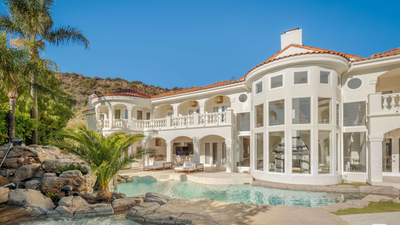 In 1991, John Stamos bought six acres in California for 0,000 and built a mansion; after later owners spent over  million renovating it, its asking price fell from  million to .4 million by 2026