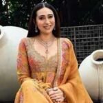 Karisma Kapoor showcases timeless ethnic elegance in a yellow Anarkali set worth Rs 2.95 lakh with intricate zardozi embroidery |