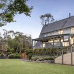 In 2005, a Wonga Park home with a 160-metre miniature railway sold for A0,000; 20 years later, the property with its electric train, tunnel and trestle bridge sold for A.375 million
