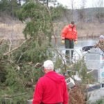 Nebraska workers cut 150 trees from crowded lake banks and sank them at 16 underwater locations; the September 2026 project is building shelter for young fish in two lakes without using concrete reefs