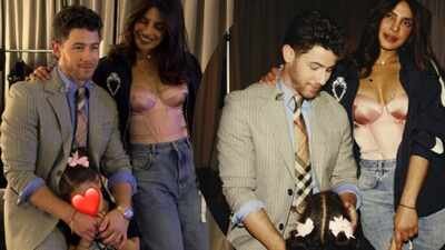 Nick Jonas, Priyanka Chopra and Malti Marie pose together for the perfect family photo while on tour with the Jonas Brothers |
