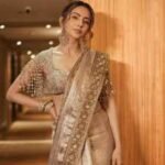 Rakul Preet Singh serves understated luxury in a Rs 2.75 lakh bronze gold tissue saree and embroidered zardozi blouse for ‘Ramayana: Rise of a Legend’ trailer launch – Exclusive |
